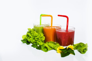 Healthy tomato and carrot smoothie in a glass isolated on white background