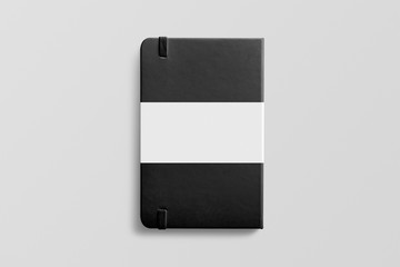 Photorealistic black leather notebook mockup on light grey background, backside view with label.