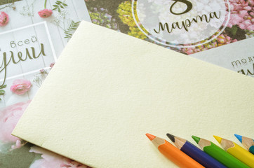 Colored pencils on a clean cardboard.