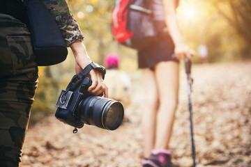 Fototapeta premium Young asian people hiking in the forest during summer at sunset,travel,tourism and teamwork concept