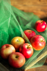 a group of red garden fresh apples on wooden background natural concept for fresh natural food and vitamins