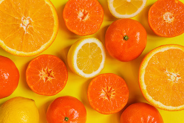 Frame of citrus fruits on yellow background. Flat lay, top view. Fruit's background