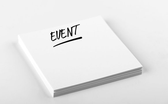 Concept of note with the word Event written on white paper. Mockup.