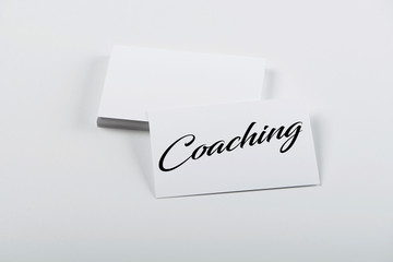 Business card concept with the word Coaching. Isolated. Mockup.