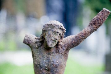 Partially destroyed ancient statue of the crucifixion of Jesus Christ (Faith, religion, suffering, love, God concept)