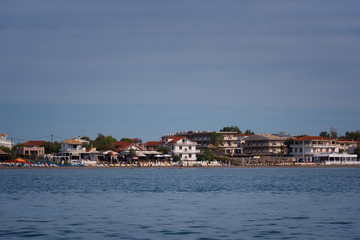Fototapeta premium View from the sea to the beach of Agios Sostis, Zakynthos Island, Greece.Typical island architecture.