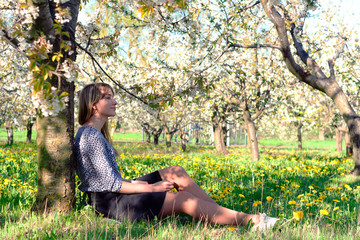 girl in a blooming spring garden