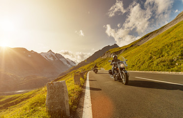 Fototapeta premium Motorcycle drivers riding in Alpine highway on famous Hochalpenstrasse, Austria, Europe.