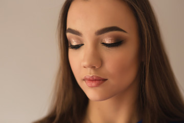 Naklejka premium Model closed her eyes to show her makeup