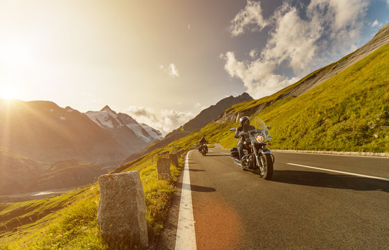 Motorcycle drivers riding in Alpine highway on famous Hochalpenstrasse, Austria, Europe.