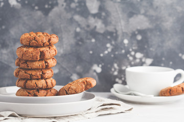 Stack of healthy aquafaba vegan cookies with tea. Vegetarian food concept.