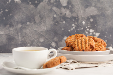Homemade healthy aquafaba vegan cookies with tea, copy space. Vegetarian food concept.