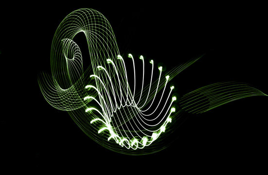 Freezing. Electric green Light. Photo, parallel lines of waves, on a black background.
