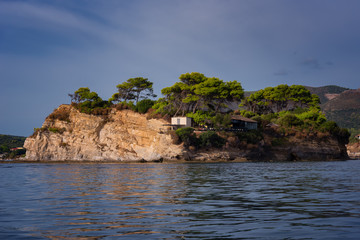 Fototapeta premium Sunny summer view of the Cameo Island. Picturesque morning scene in the Port Sostis, Zakynthos (Zante) island, Greece, Europe. Beauty of nature concept background.
