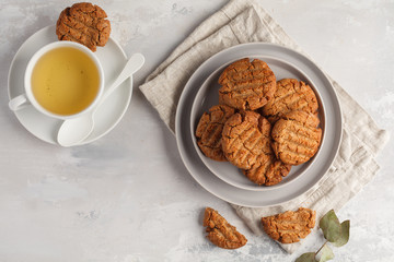 Homemade healthy aquafaba vegan cookies with tea, top view, copy space. Vegetarian food concept.