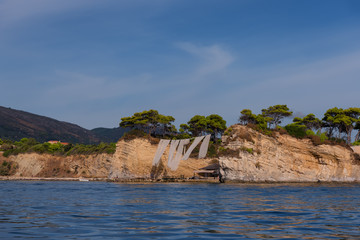 Sunny summer view of the Cameo Island. Picturesque morning scene in the Port Sostis, Zakynthos...