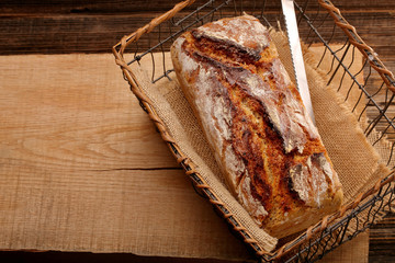 Spelled bread on wooden background