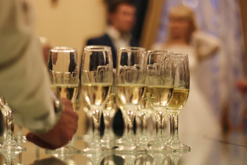Wedding Accessories. Bridal bouquet and champagne glasses.