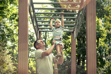 Obraz premium Father and son exercising outdoor.