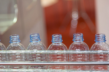 The plastic bottle in the conveyor belt at the water drinking factory