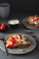french toasts with yogurt and strawberries for breakfast