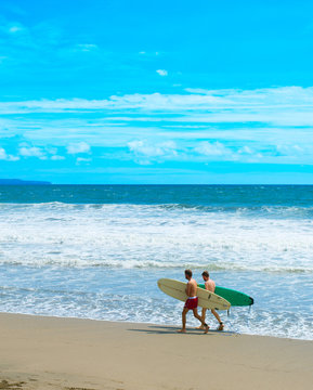 Two surfers on ocean beach