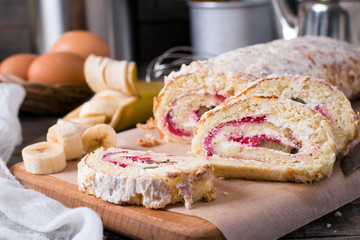 Homemade sweet biscuit roll with cream and fruit