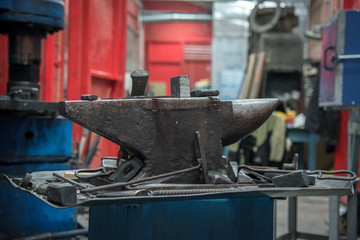 old anvil and various forging tools