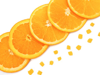 Fresh orange slice and small pieces on white background