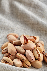 Pistachios on fabric cotton napkin, sallow depth of field, selective focus, top view, macro