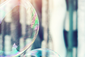 Soap bubbles with reflection of city buildings