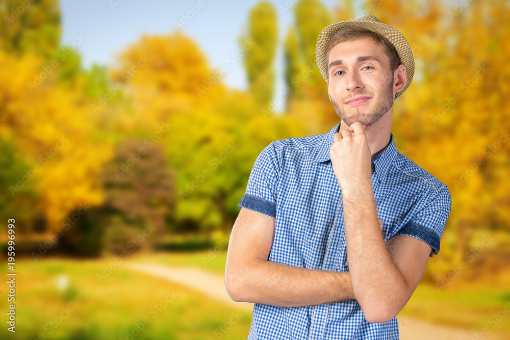 Wall mural Portrait of handsome young thoughtful man