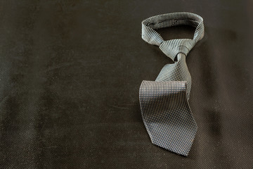 tie on dark background