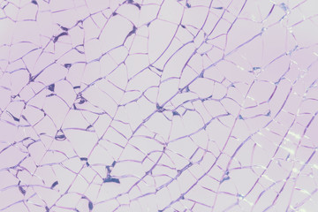 Cracked glass, pink background, texture