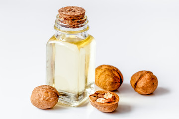 cosmetic and therapeutic walnut oil on white background
