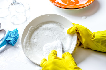 concept of woman washing dishes on white background