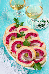Sandwich with herring fillet, onion, pickled cucumber, cream cheese and beetroot