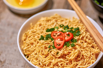 instant noodle in bowl cooked spicy taste topping with eggs