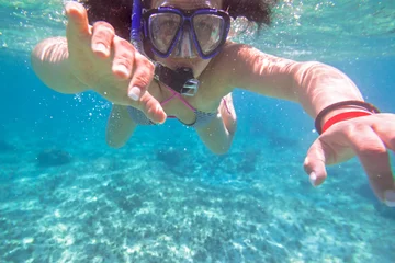 Fotobehang Young woman snorkeling in the tropical water of Mexico © Patryk Kosmider
