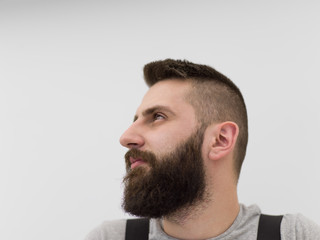 Obraz premium portrait of bearded hipster handyman isolated on white