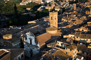 Fototapeta na wymiar Picturesque aerial view of Chiesa di San Martino from Torre del Mangia tower at sunset, Siena, Tuscany, Italy. Scenic travel destination postcard.