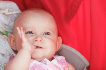 Little happy baby in stroller