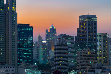 Fototapeta na wymiar modern office buildings and condominium in Bangkok city downtown with sunset sky and clouds at Bangkok , Thailand.