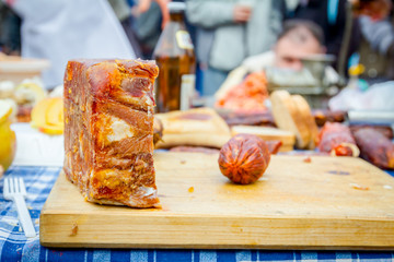 Headcheese and dry sausage on a wooden chopping board