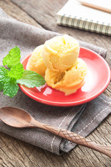 Homemade organic mango ice cream on red plate, Summer lifestyle