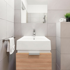 Fototapeta premium Beige bathroom with countertop basin