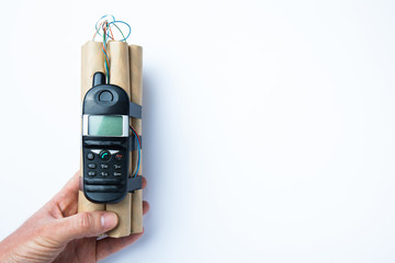 Improvised explosive device bomb in hand, copy space for text.