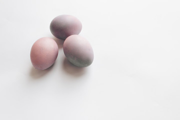 Painted Easter eggs on white background, festive background