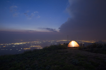 Fototapeta na wymiar Tent camping in nature at night blue sky.