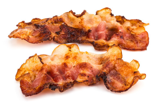 two slices of fresh fried bacon isolated on a white background